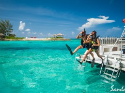 Scuba - couples jump off a boat together in their gear